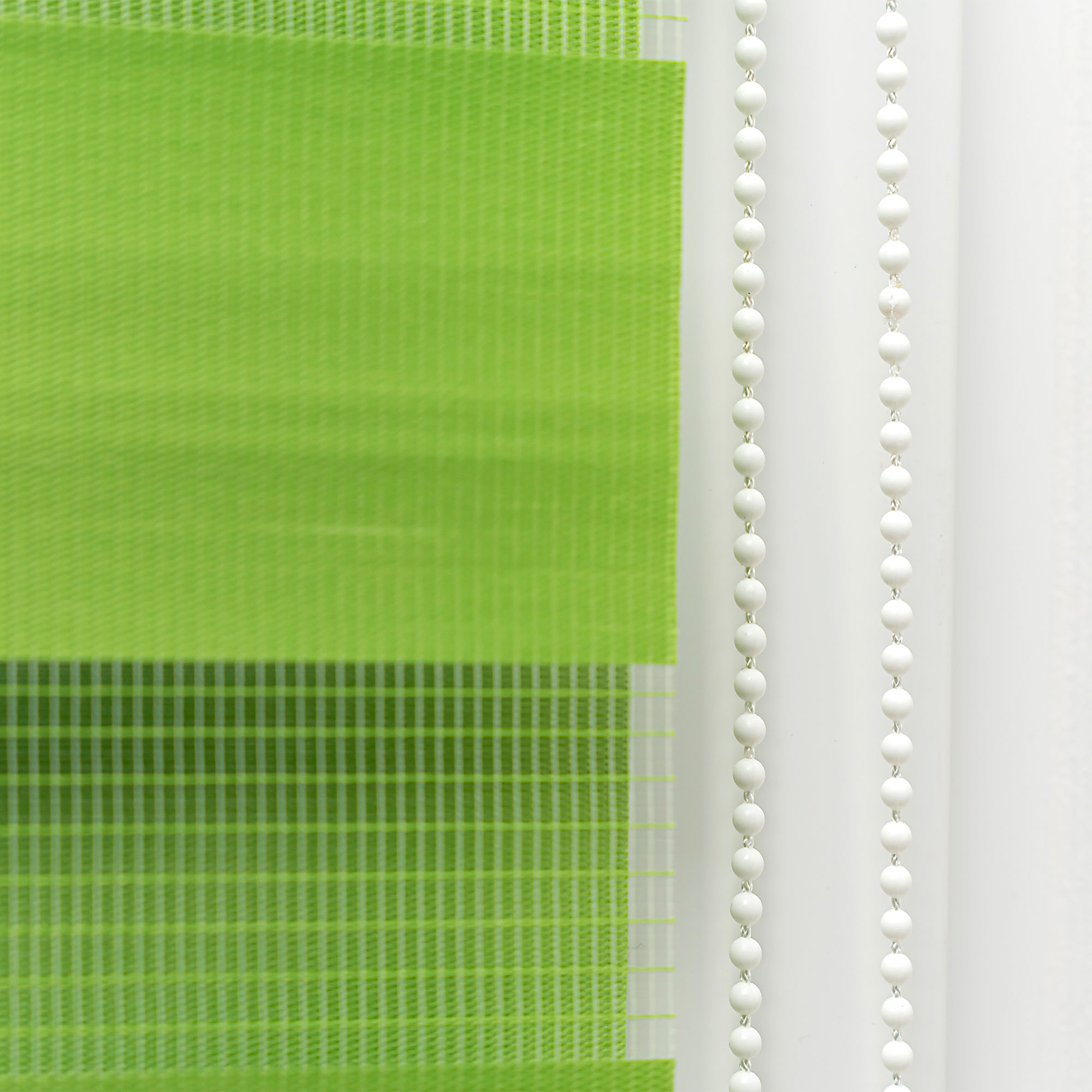 slider_image_80005fc215ac46fba2d6e5d988310a27 Vertikale Jalousie mit Kettenzug, halbtransparentes Material, Detailansicht