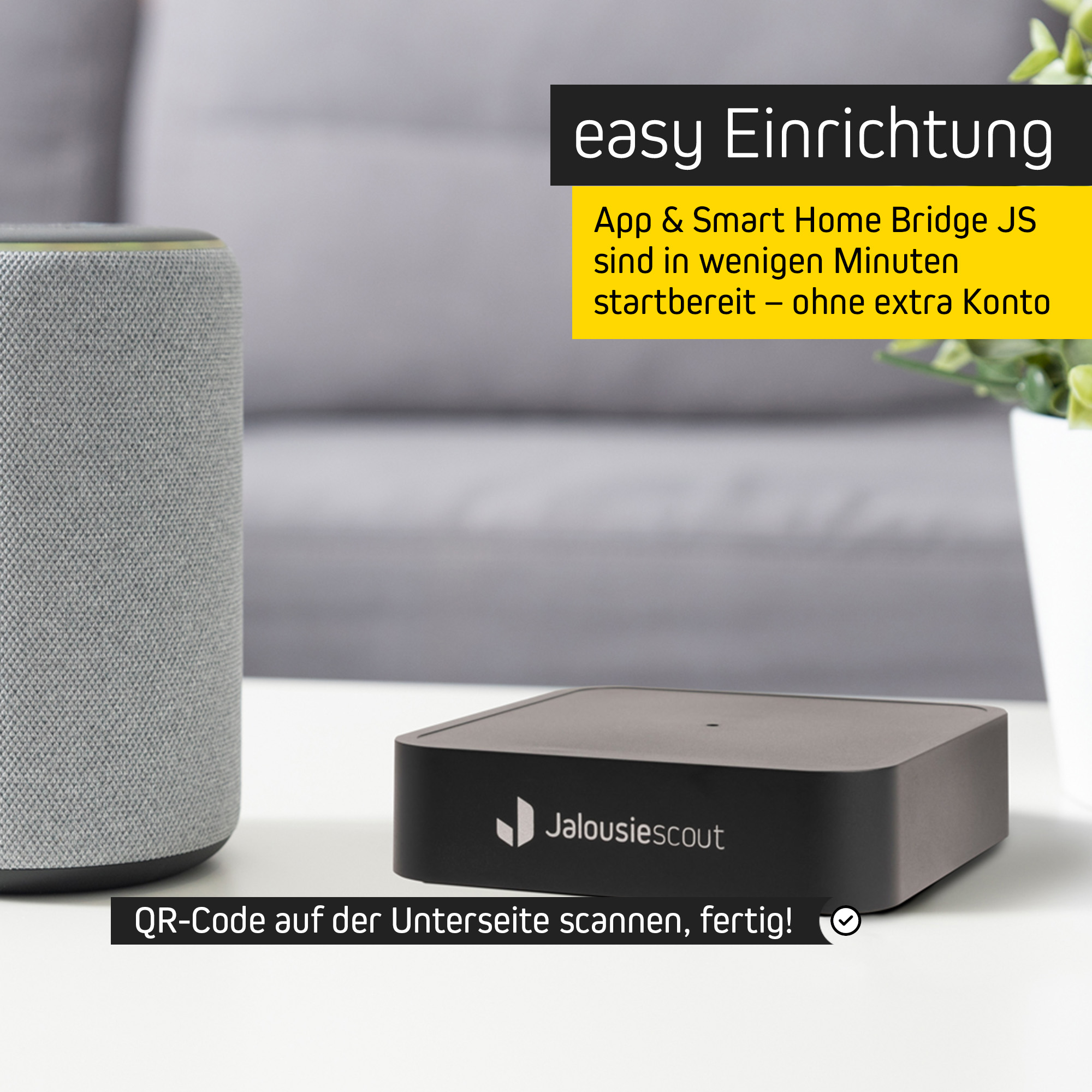 Smart-Home-Bridge JS auf Tisch neben Lautsprecher und Pflanze